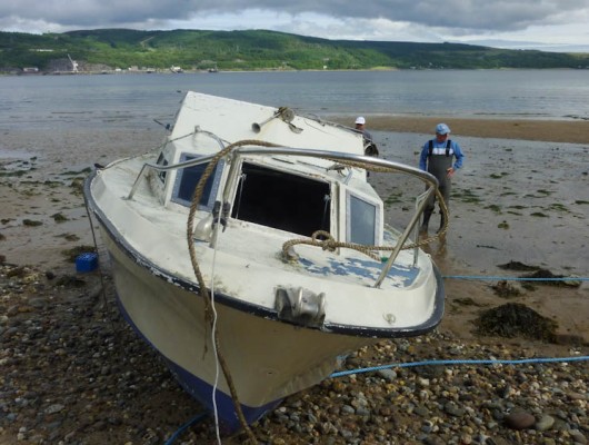 The retrieved boat on Sandy Beach