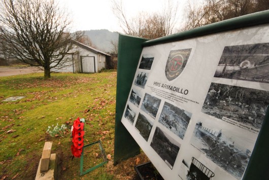 HMS Armadillo information board with hut in background