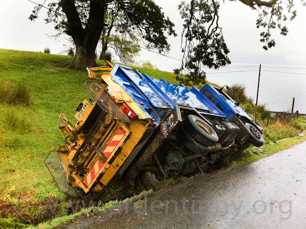 Council refuse truck topples into ditch